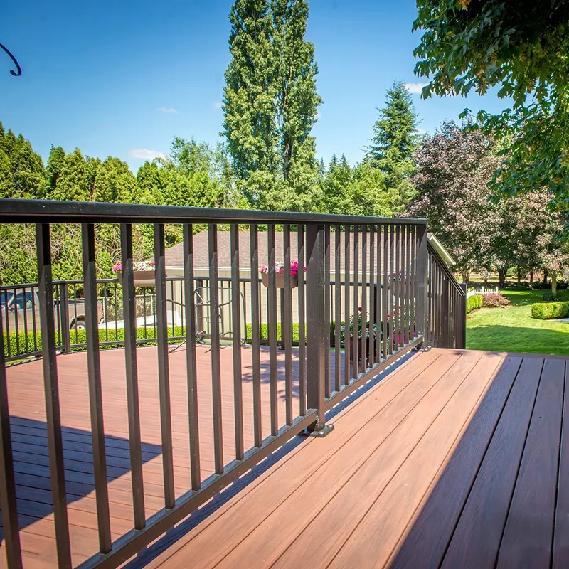 Modern aluminum railing for decks with glass panels overlooking mountain view