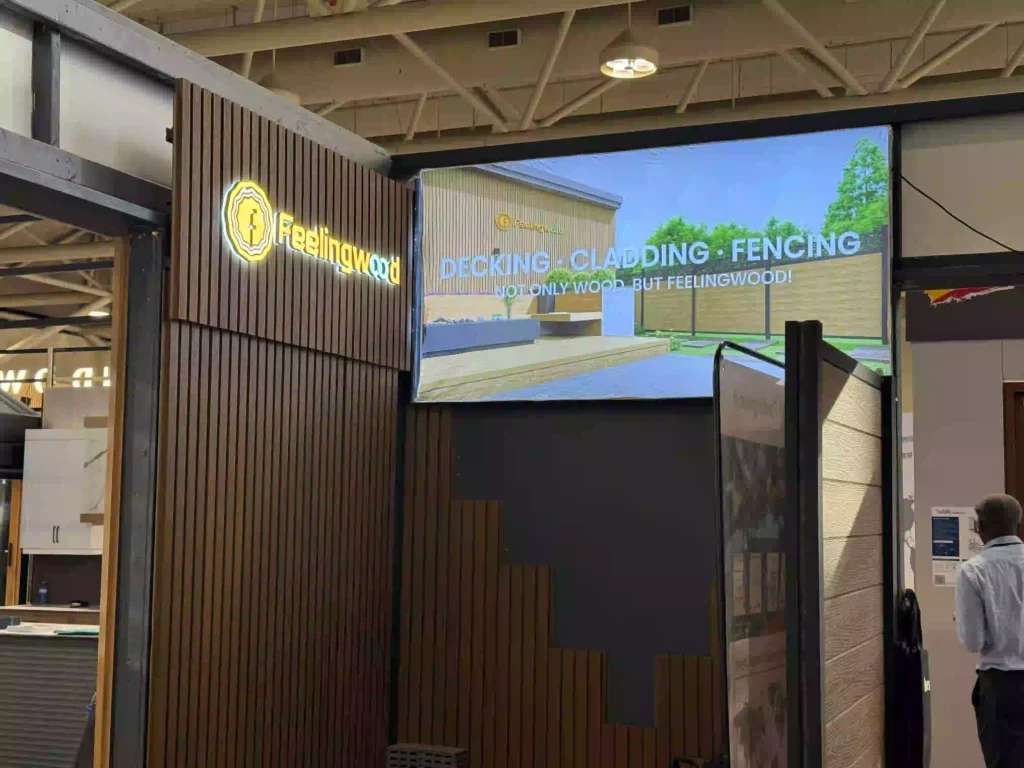 FeelingWood exhibition booth displaying WPC decking, cladding, and fencing systems