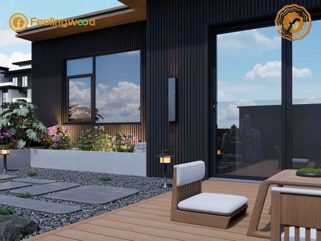 Feelingwood WPC cladding applied on the exterior wall of a modern home, featuring sleek black vertical panel design paired with a contemporary outdoor garden space