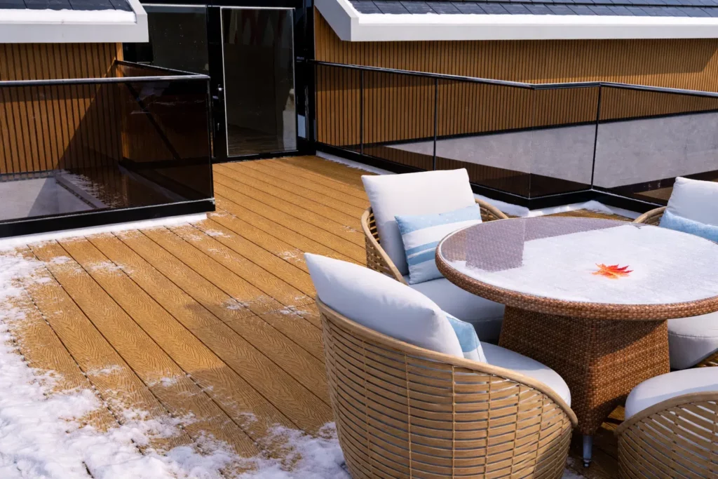 Feelingwood WPC decking  and WPC cladding on a Canadian residential rooftop patio (with residual winter snow)—showcasing freeze-thaw resistant performance and decorative unity of WPC materials.
