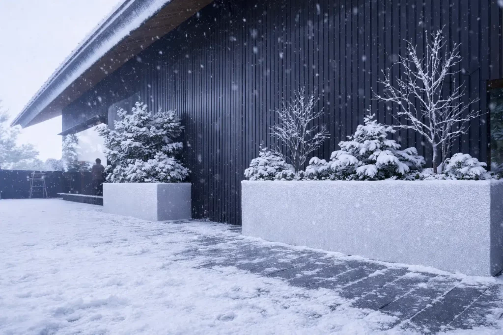 Feelingwood black WPC cladding on a Canadian residential exterior wall during heavy winter snow—showcasing freeze-thaw resistant performance and decorative stability in cold climates.