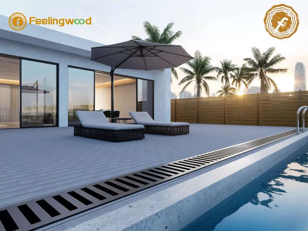 Semi-private composite fencing from Feelingwood defines the pool boundary, while durable WPC decking forms a stylish outdoor relaxation area with lounge chairs.