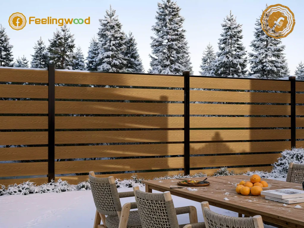 Durable semi-private composite fencing from Feelingwood, designed for snowy cold climates, enclosing an outdoor dining area with modern aesthetic and weather resistance.