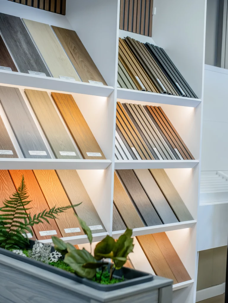 FeelingWood WPC decking samples displayed in a Canadian showroom, showcasing a range of colors and textures for dealers to explore outdoor material options.