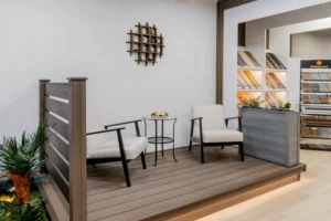 FeelingWood WPC showroom in Canada featuring outdoor-style seating area with composite decking display, showcasing deck railing samples and coordinated material presentation for dealer clients.