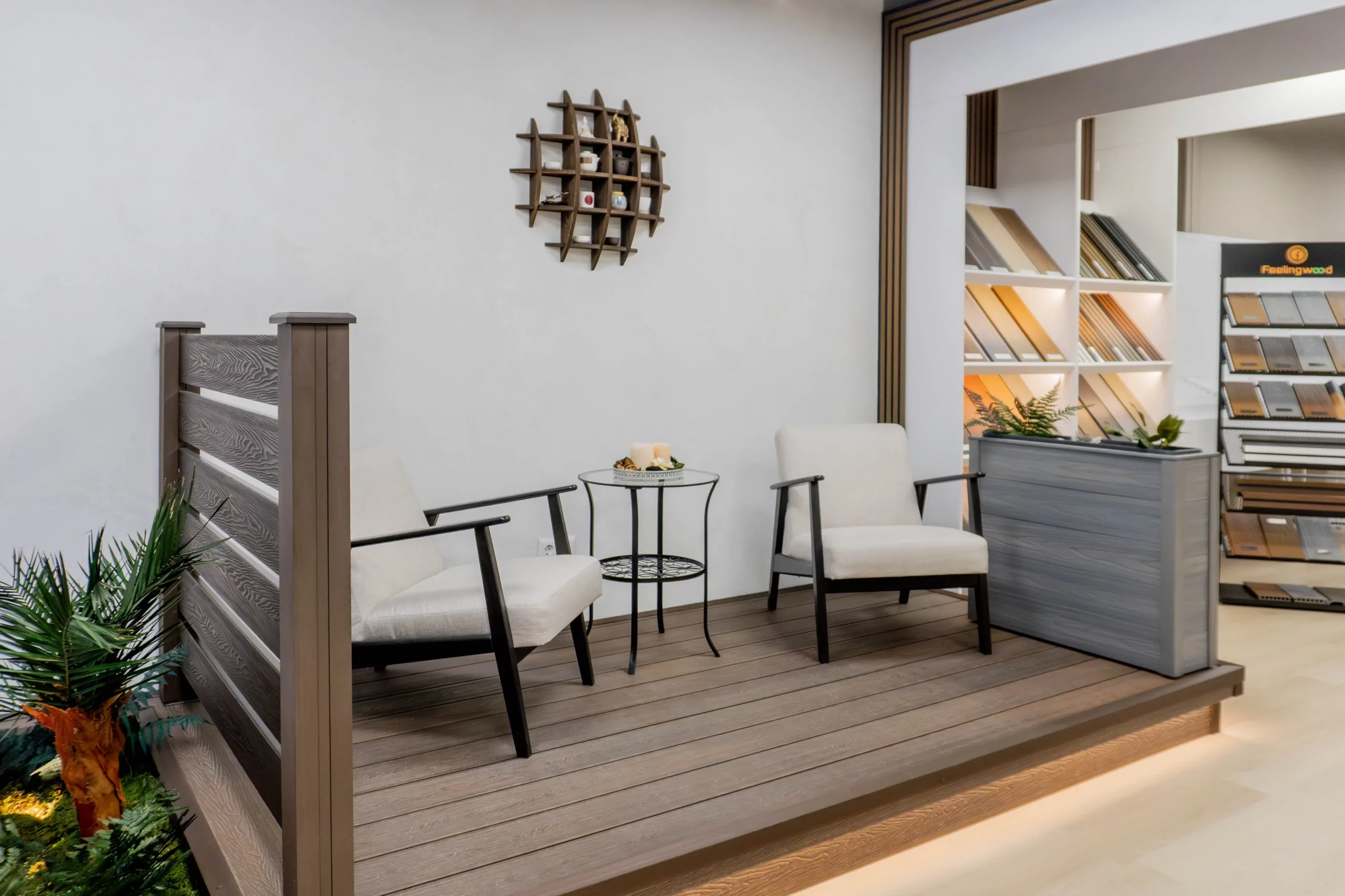 FeelingWood WPC showroom in Canada featuring outdoor-style seating area with composite decking display, showcasing deck railing samples and coordinated material presentation for dealer clients.