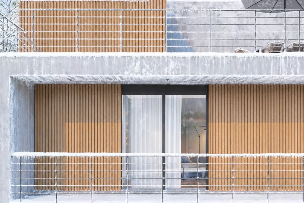 modern Canadian home exterior cladding made of WPC with snow-covered facade and balcony